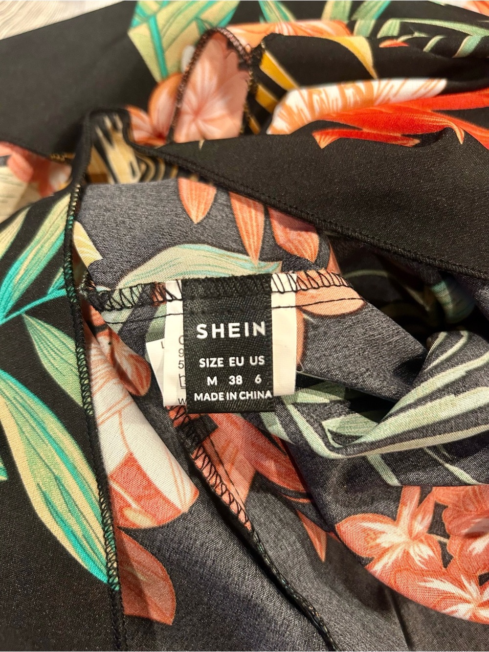 SHEIN Black Tropical Floral Wrap Romper with Red & Green Accents - Picture 4 of 4